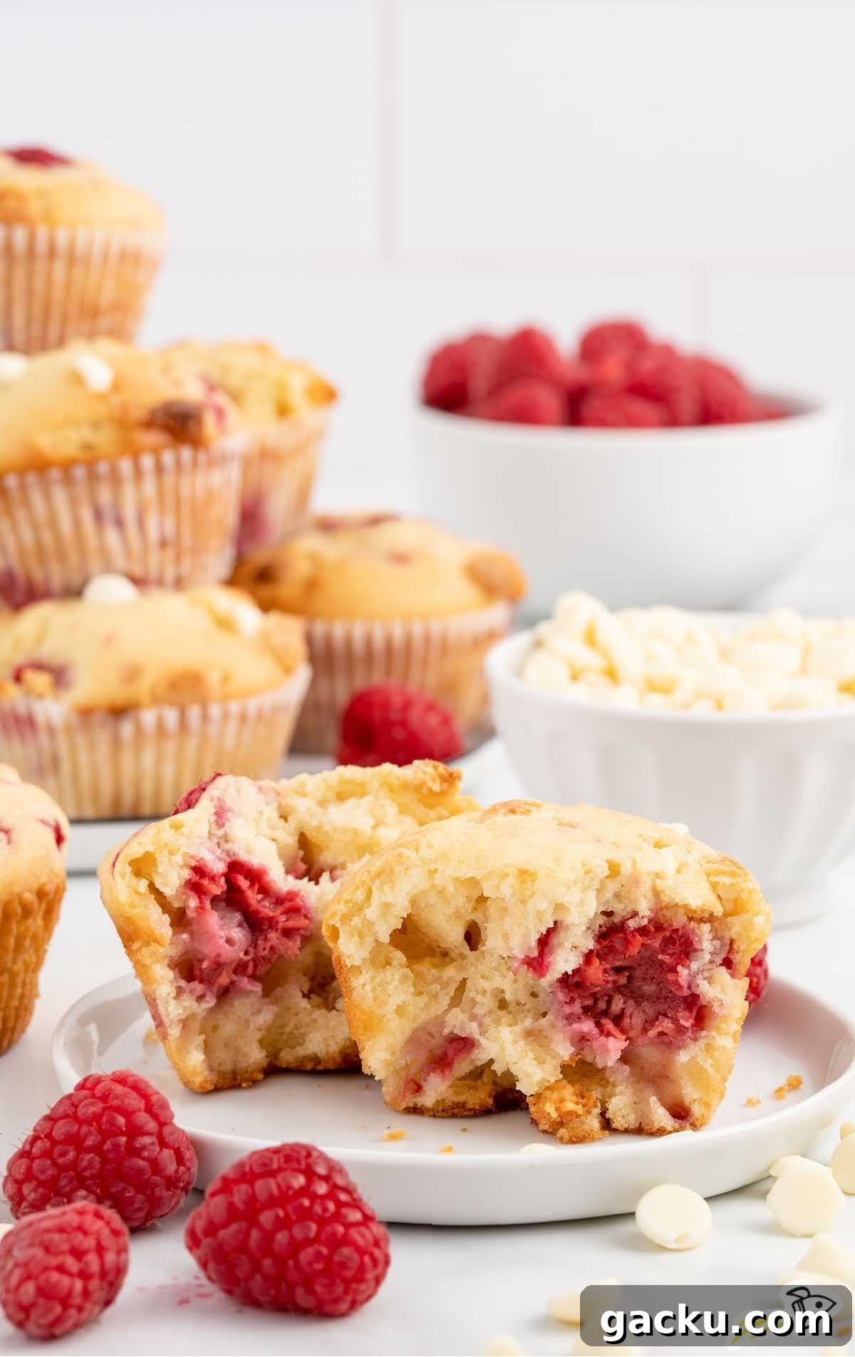 White Chocolate Raspberry Muffins with Fresh Raspberries 10 White Chocolate and Raspberry Muffins on a plate