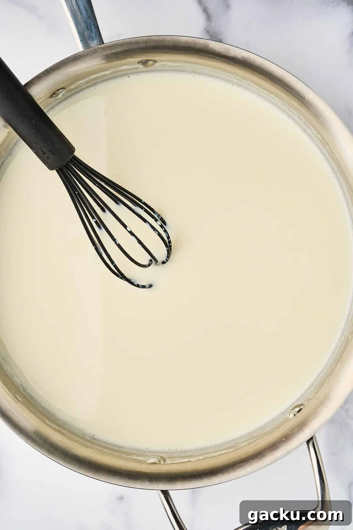 Herbed French Macaroni & Cheese with Ham 4 Warm milk whisked into béchamel sauce for French macaroni and cheese.