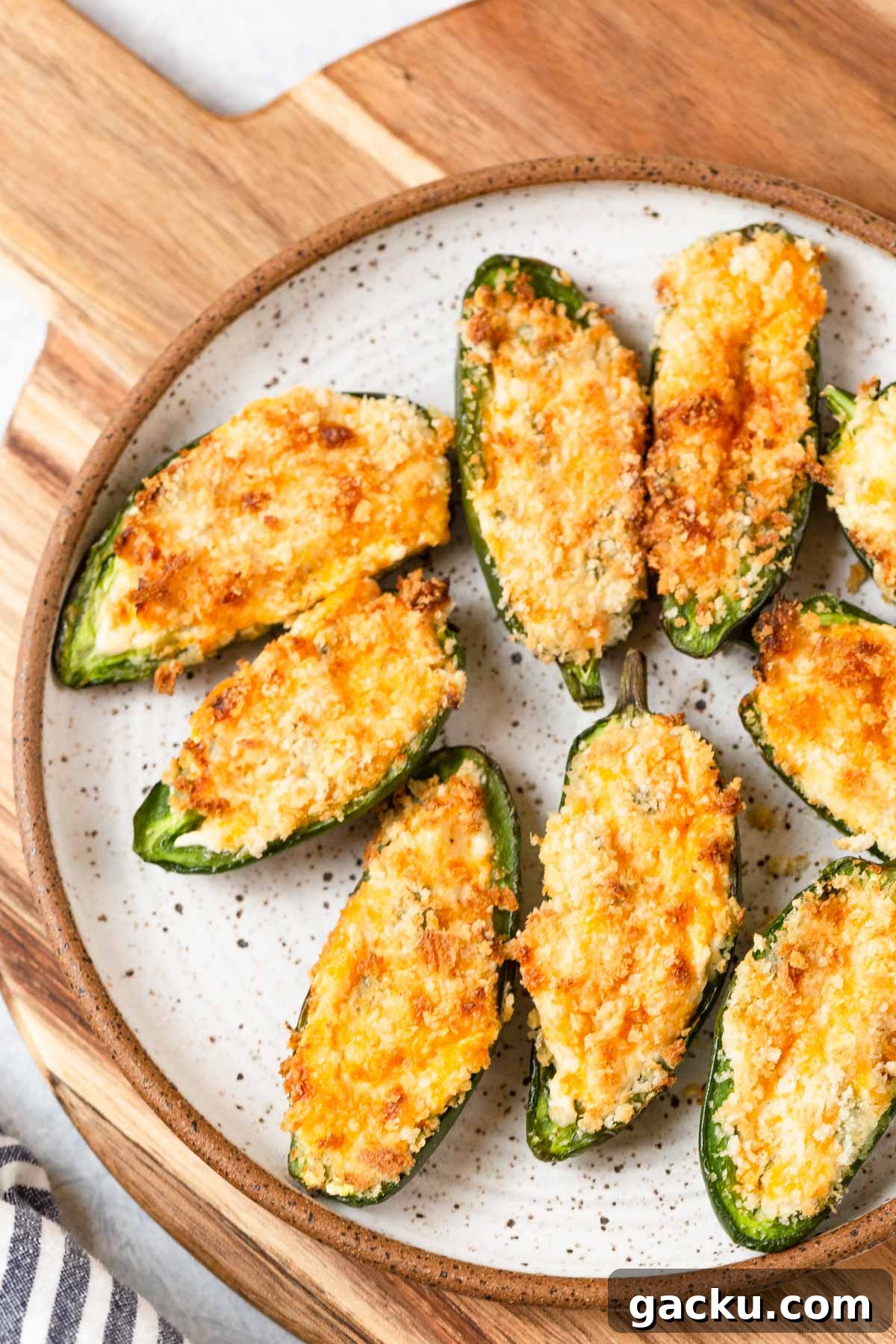 Crispy Air Fryer Jalapeño Poppers: Quick Appetizer Recipe 2 Crispy jalapeno poppers on a plate.