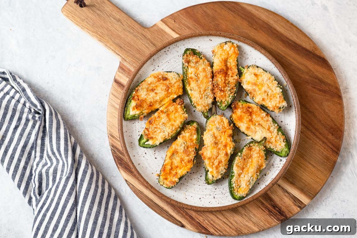 Crispy Air Fryer Jalapeño Poppers: Quick Appetizer Recipe 11 air fryer jalapeno poppers on a plate with a napkin