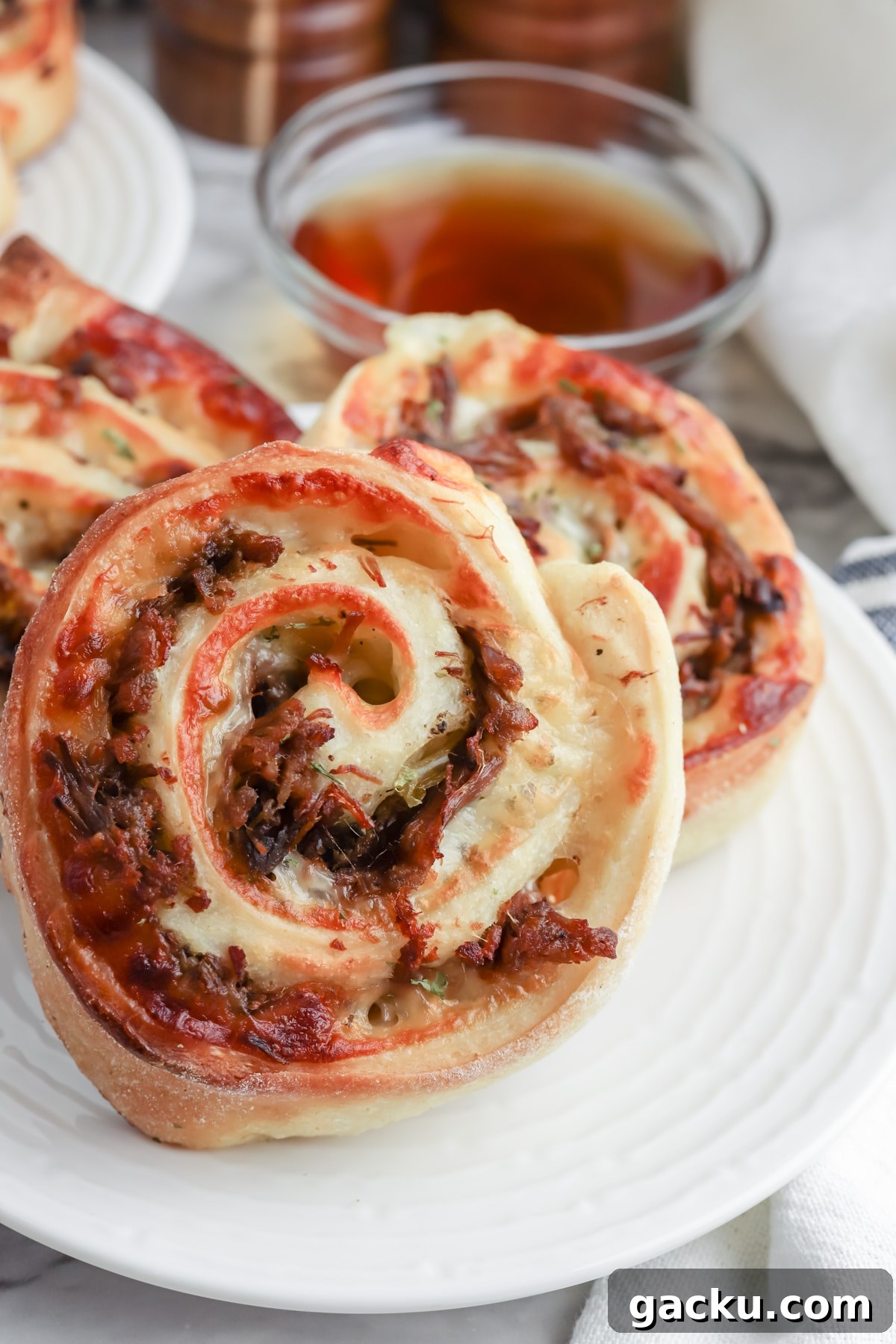 serve italian beef pinwheels with reserved broth