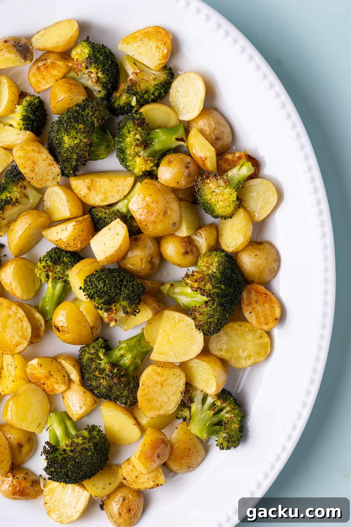 30-Minute Roasted Baby Potatoes & Broccoli with Garlic Butter 2 Close up of serving platter with roasted potatoes and broccoli.
