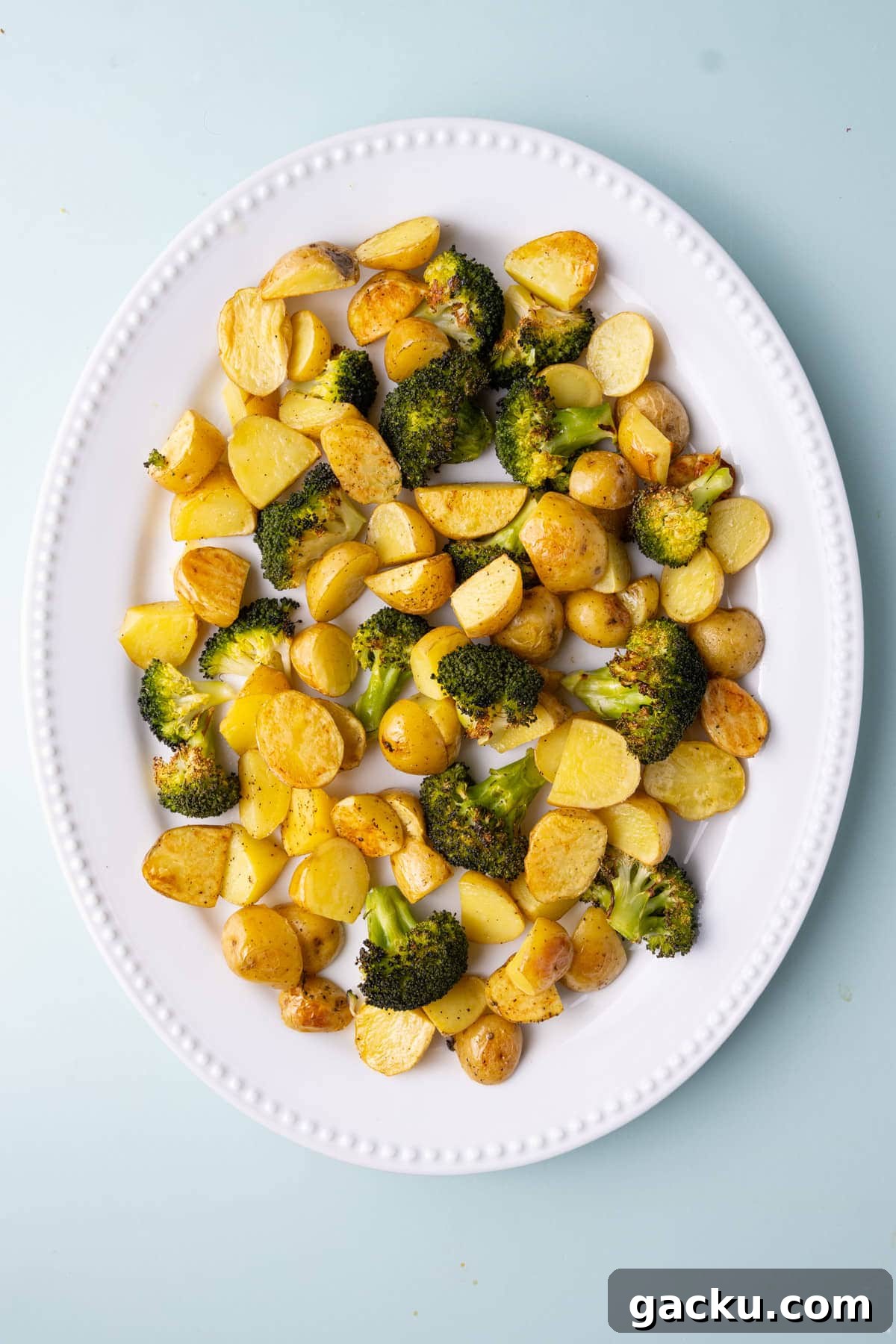 30-Minute Roasted Baby Potatoes & Broccoli with Garlic Butter 8 Large serving platter with roasted potatoes and broccoli.