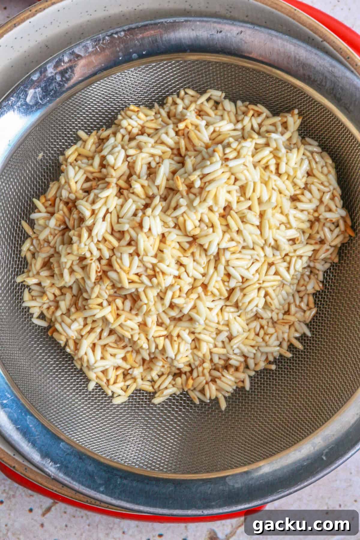 Authentic Mexican Red Rice Recipe: Fluffy, Flavorful Arroz Rojo 5 Place rice in a strainer and strain the oil