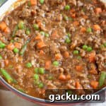 Savory Mince Recipe: Quick Homemade Beef Mince for Dinner 9 Savoury mince in a red pan.