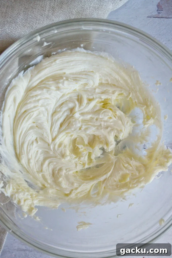 Mini Peanut Butter Espresso No-Bake Cheesecakes 13 whipped cream cheese and butter in a glass bowl
