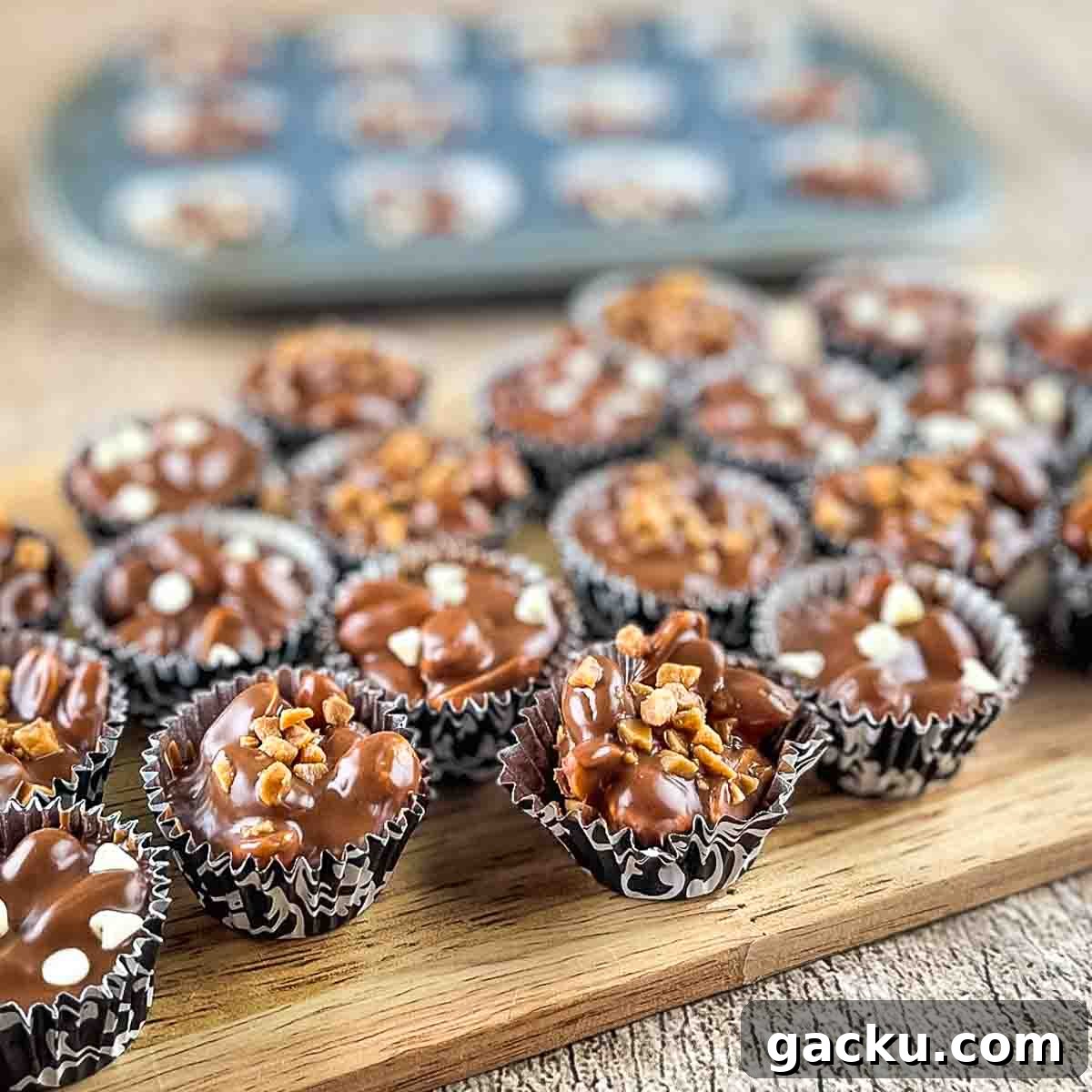 The crockpot candy on a wooden serving board.