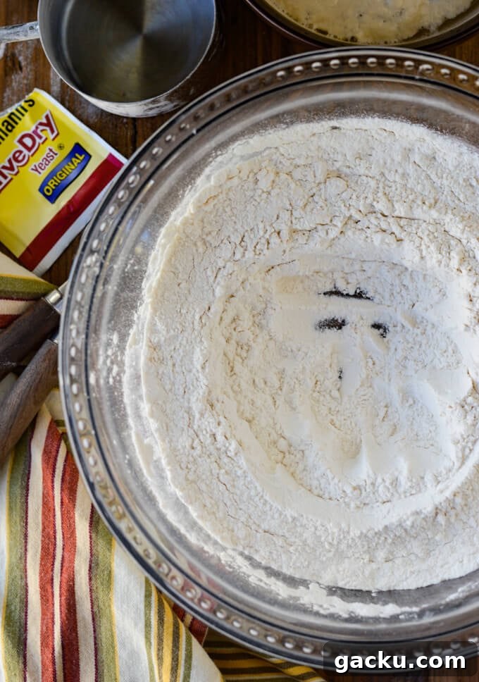 Ingredients for homemade pizza dough. A bowl of flour with a well in the middle.