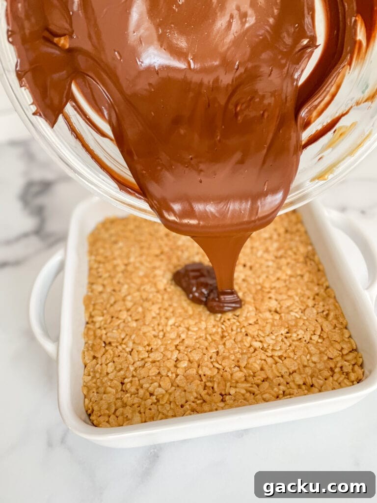 Melt chocolate chips and peanut butter together in the microwave and pour over you pan of Rice Krispies Treats