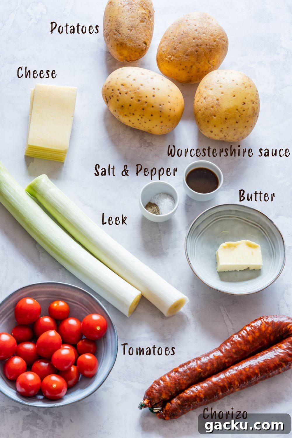 Ultimate Twice-Baked Potatoes Recipe for Crispy, Cheesy Potatoes 3 Ingredients of twice baked potatoes - potatoes, tomatoes, leek, chorizo, cheese, worcestershire sauce, salt and pepper.