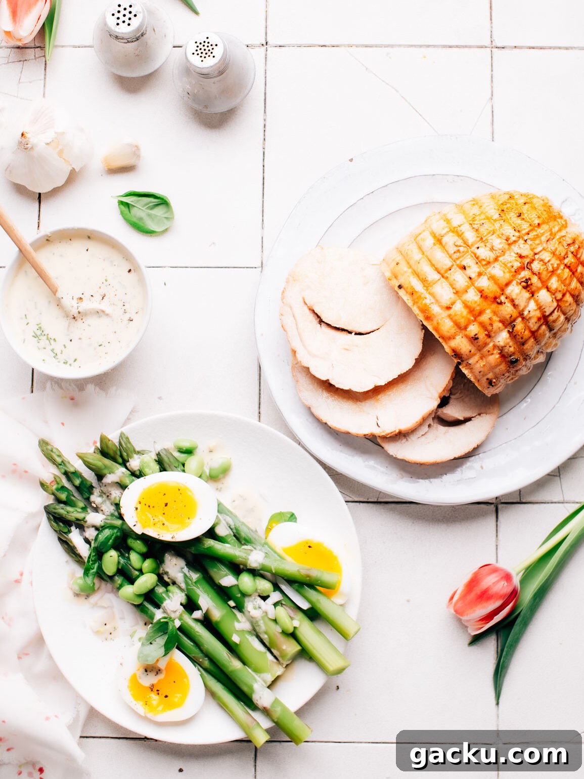 Lemon Tahini Dressing served with asparagus and turkey roast.