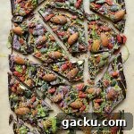Superfood chocolate bark - dark chocolate topped with almonds, goji berries, seeds, bee pollen and white chocolate flavoured with matcha and freeze dried blueberry powder