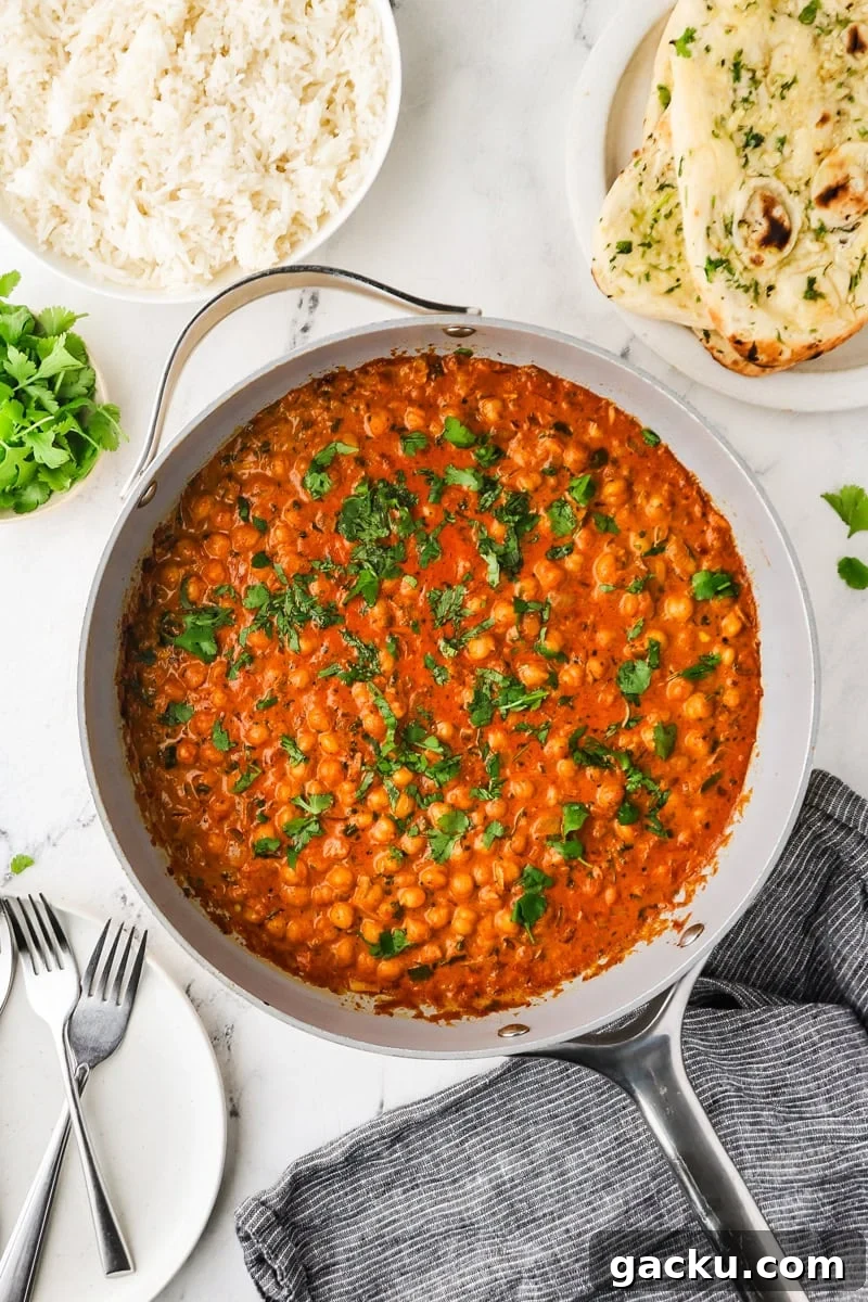 Restaurant-Style Chickpea Tikka Masala Recipe 10 An overhead image of the chickpea tikka masala served in a skillet.