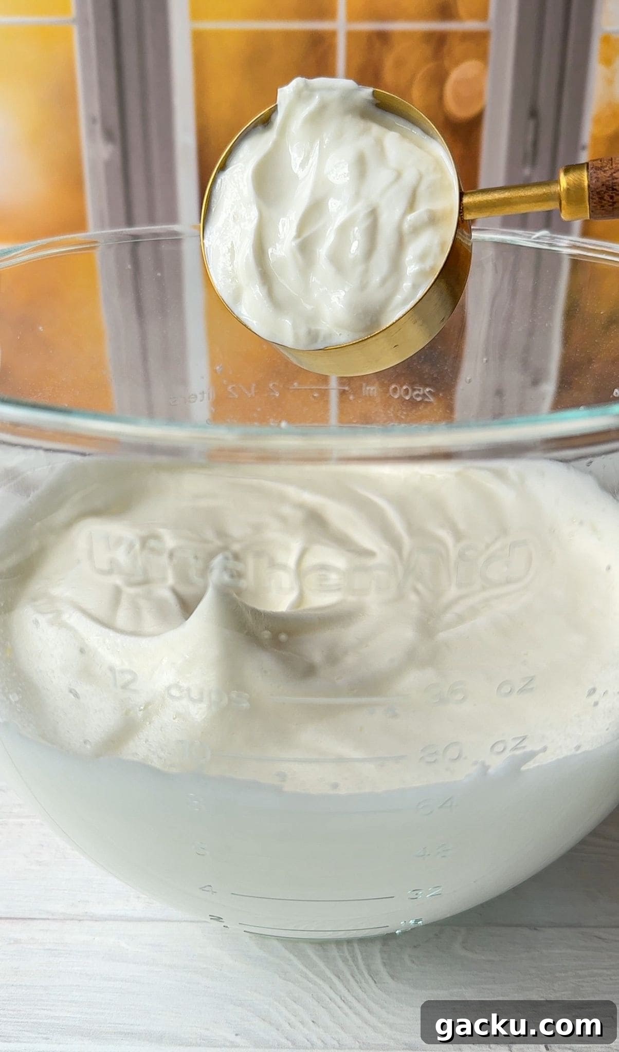 Fluffy Cloud Bread Recipe: Soft, Airy Sandwich Loaf in Minutes 5 The yogurt is being added to the whipped egg whites.