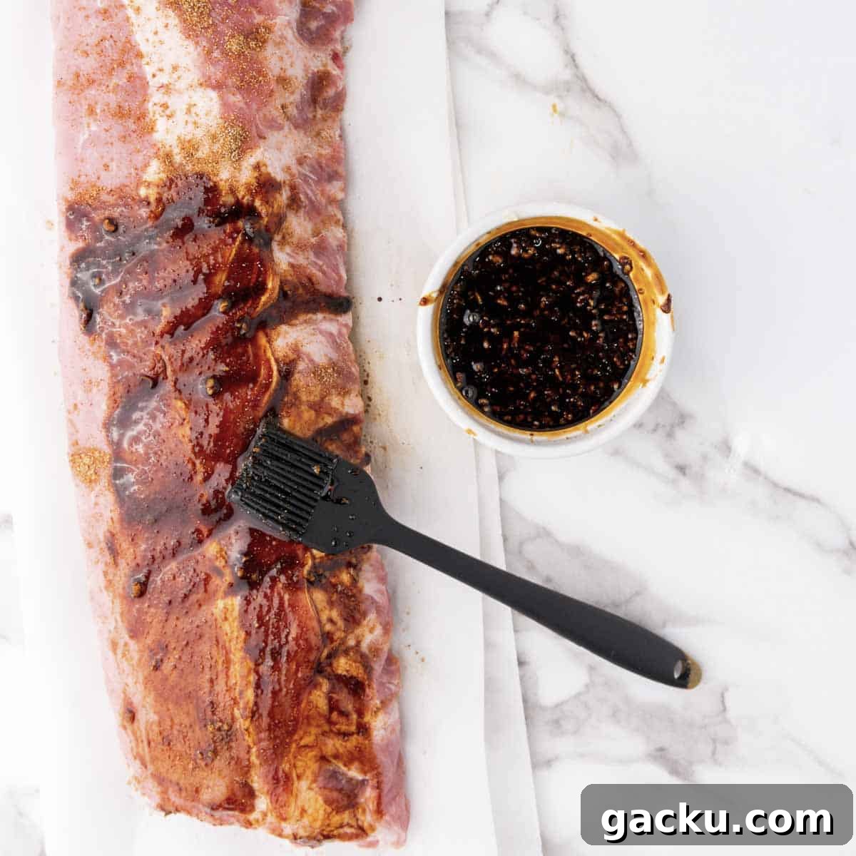 Slow-Cooked Honey Garlic Ribs with Sticky Glaze 5 Mince the garlic and combine with the dark soy sauce, sweet soy sauce, and honey. Brush over the ribs and save some of the marinade.