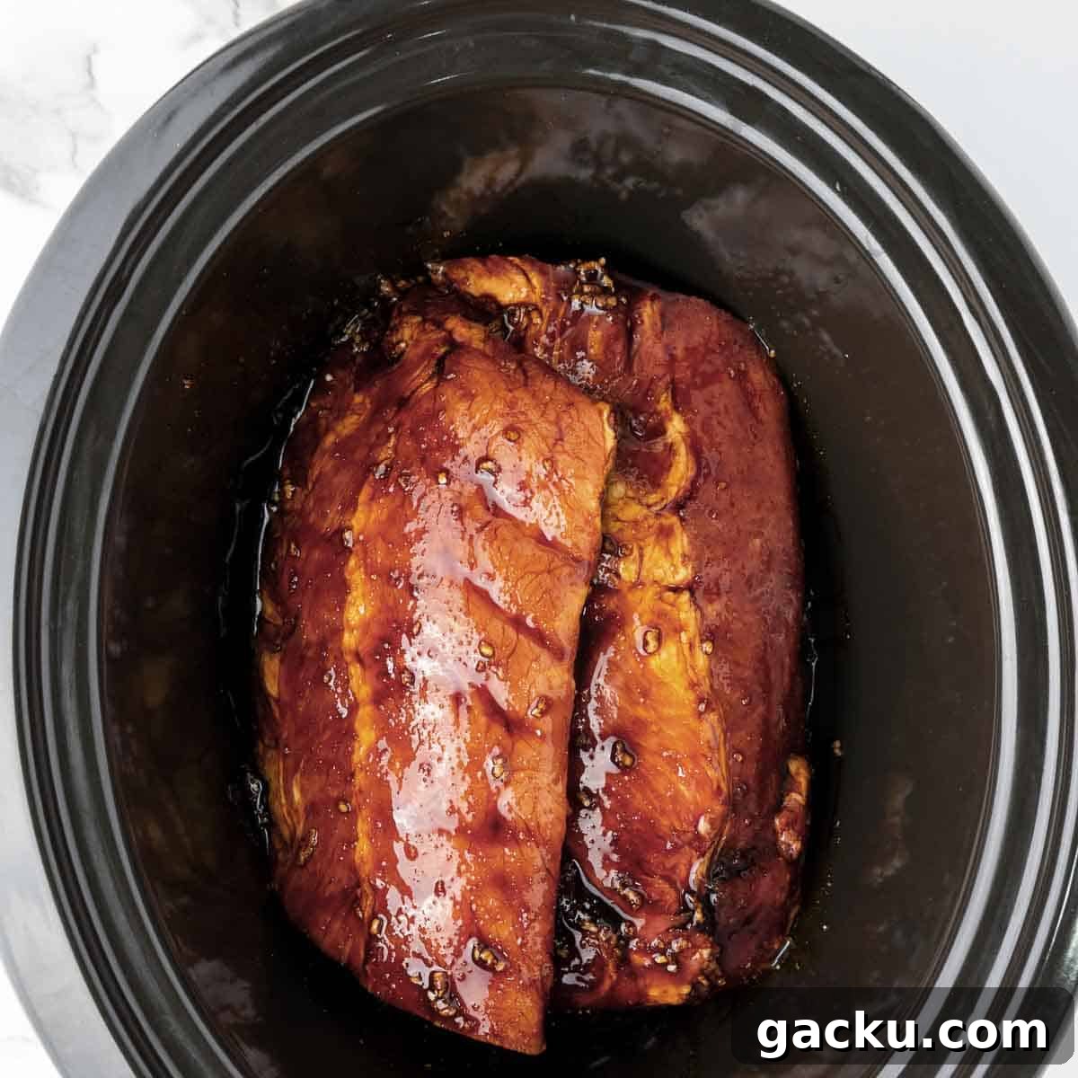 Slow-Cooked Honey Garlic Ribs with Sticky Glaze 6 Cut the ribs in half and place in the slow cooker. Cook for 6-7 hours on low or 3-4 hours on high.