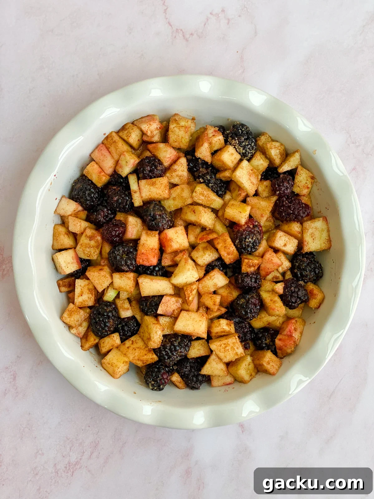 Blackberry Apple Crumble Recipe: Rustic Dessert with Oat Topping 8 filling in the pie plate.