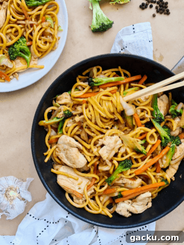 Stir fried noodle sin a black pan