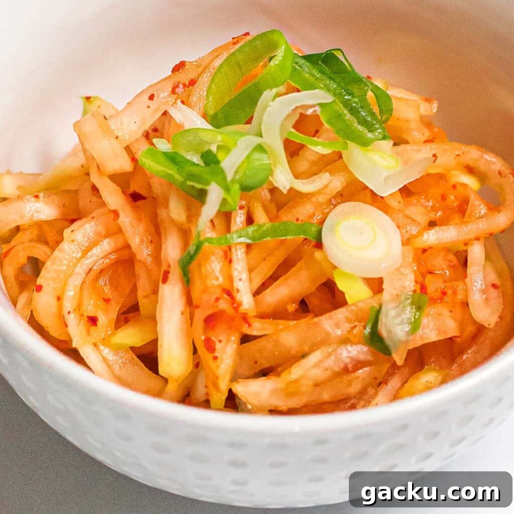 spicy Korean radish salad in a white bowl