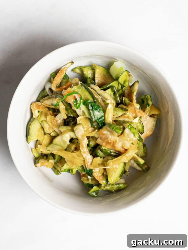 overhead of Korean dried zucchini side dish in a white bowl