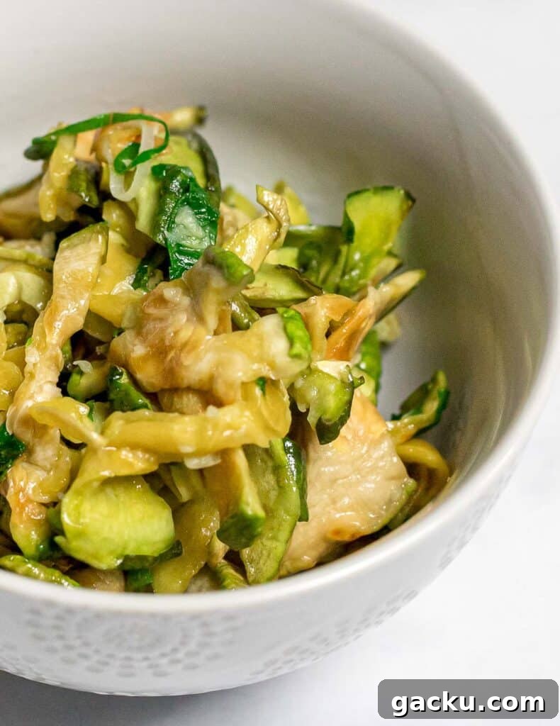 closeup of Korean dried zucchini side dish in a small white bowl