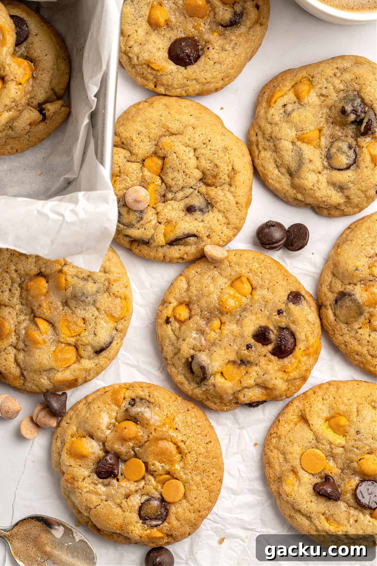 Chewy Butterscotch Chocolate Chip Cookies — No-Chill Dough Recipe 9 Flay lay of butterscotch chocolate chip cookies on white paper.