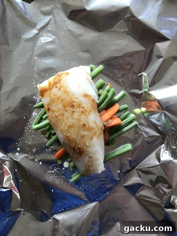 Cod, Carrot & Green Bean Foil Packets with Lime Avocado Sauce 3 Cod, Carrot and Green Bean Foil Packets with lime avocado sauce via LizsHealthyTable.com