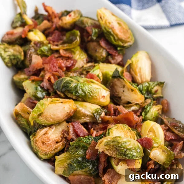 A white bowl filled with brussels sprouts and bacon.