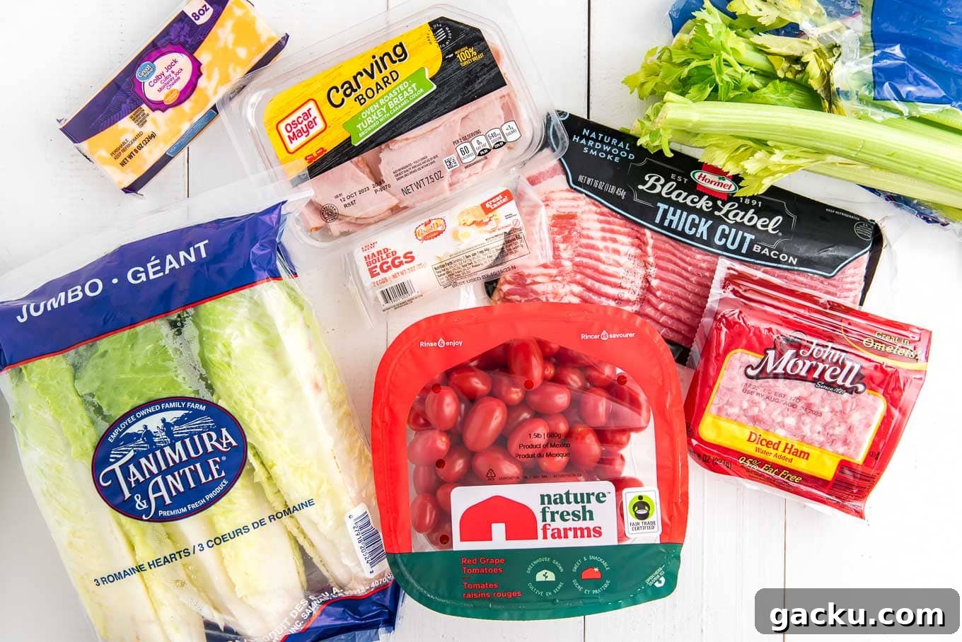 Ingredients in a chef salad recipe on the table before prepping up.
