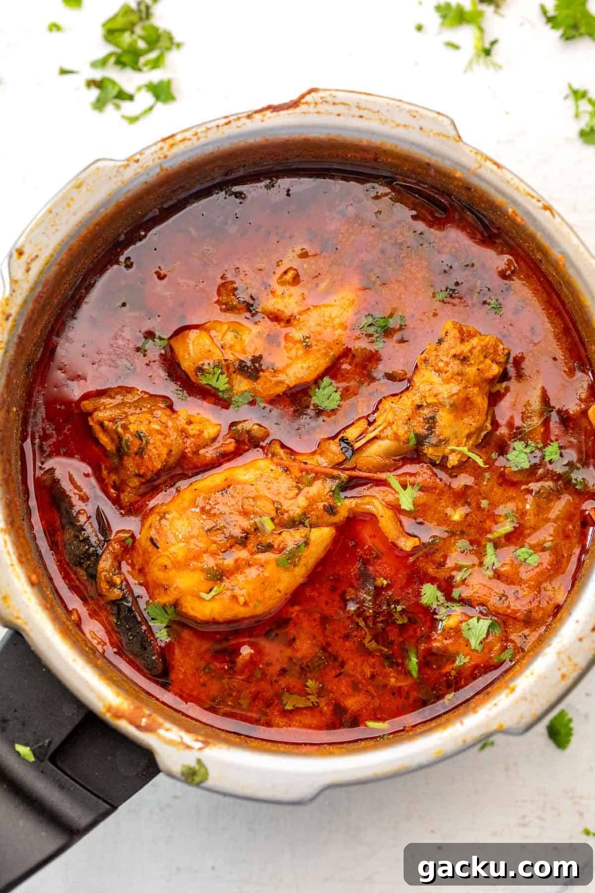 Quick Pressure Cooker Chicken Curry Recipe for Tender, Flavorful Chicken 2 Pressure cooker chicken curry in a pressure cooker on a white background