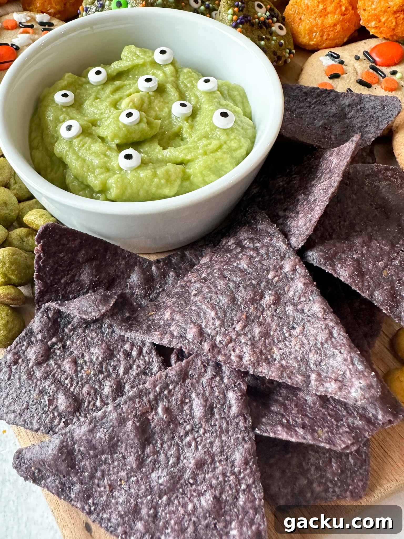 Kid-Friendly Halloween Snack Ideas Kids Will Love 18 Guacamole and blue corn chips.