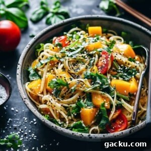 Asian noodle salad with mango and vegetables.