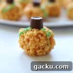 pumpkin rice krispie treat on white surface