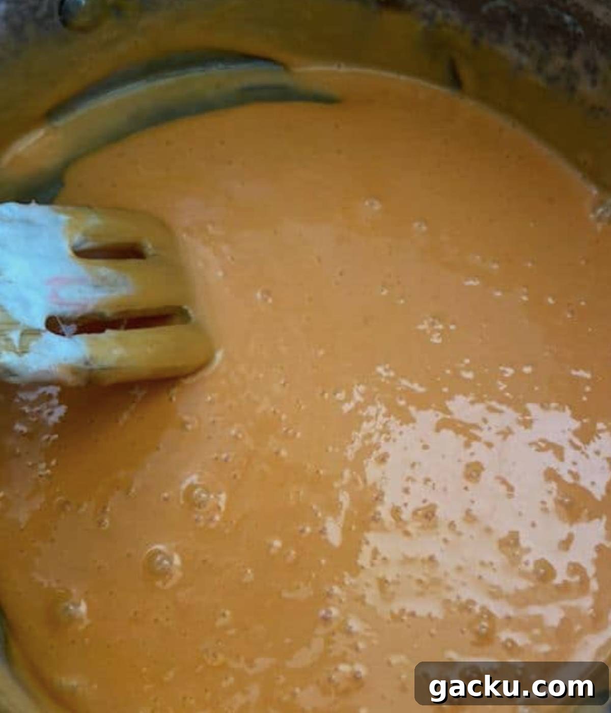 Pumpkin Rice Krispie Treats Recipe for Fall Desserts 5 Orange Marshmallow filling in pot.