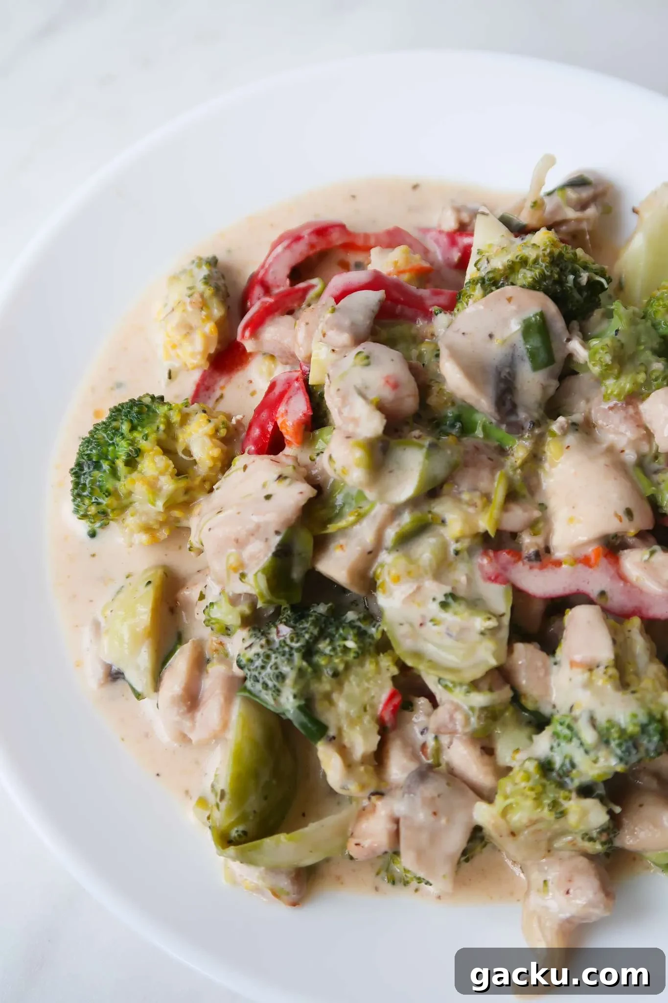 Best keto dinner idea ever: Creamy keto chicken with vegetables is full of flavor, cheesy, creamy, garlicky and delicious! This is a super easy healthier creamy keto dinner recipe using boneless skinless chicken thighs, Parmesan cheese and vegetables!