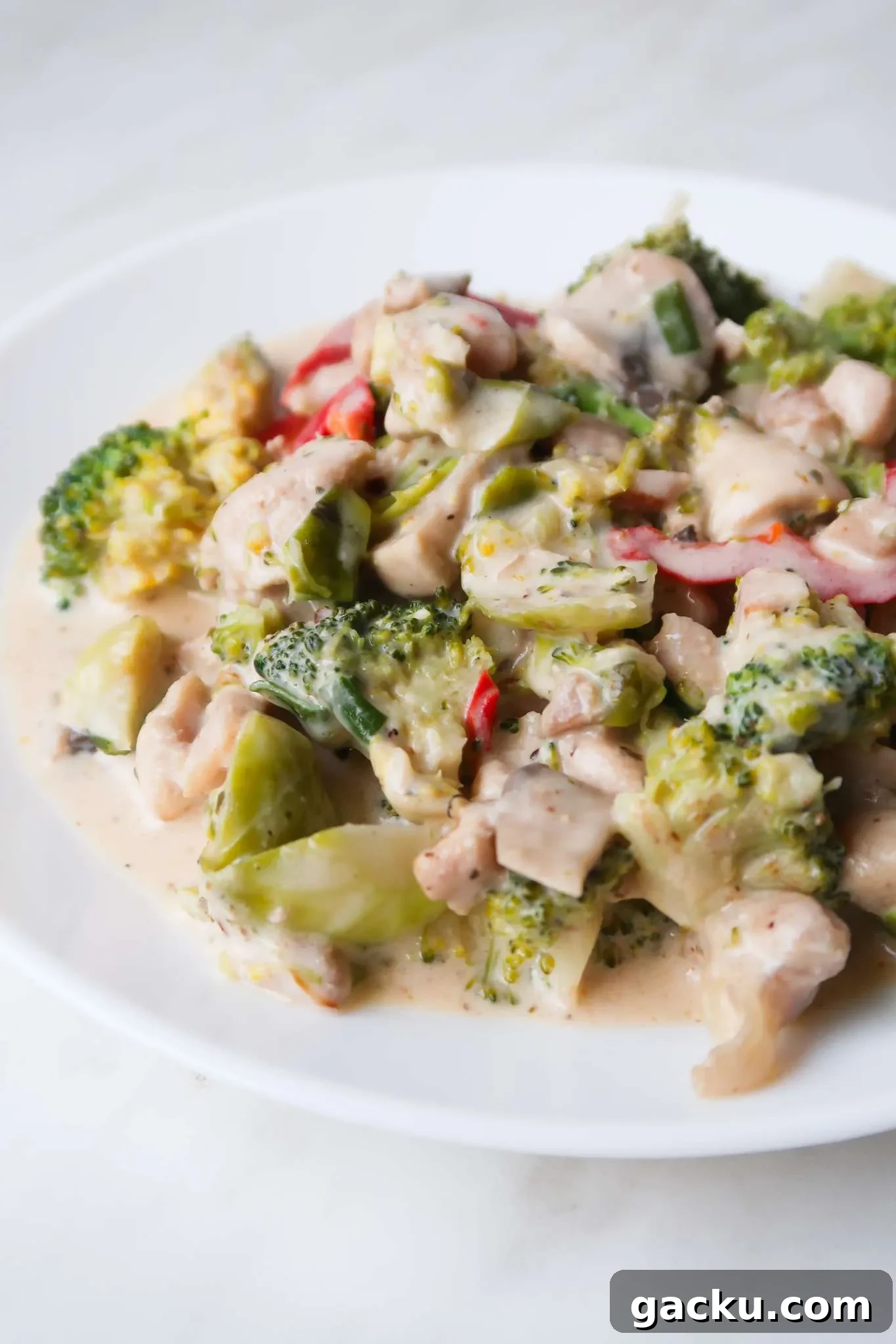 Best keto dinner idea ever: Creamy keto chicken with vegetables is full of flavor, cheesy, creamy, garlicky and delicious! This is a super easy healthier creamy keto dinner recipe using boneless skinless chicken thighs, Parmesan cheese and vegetables!
