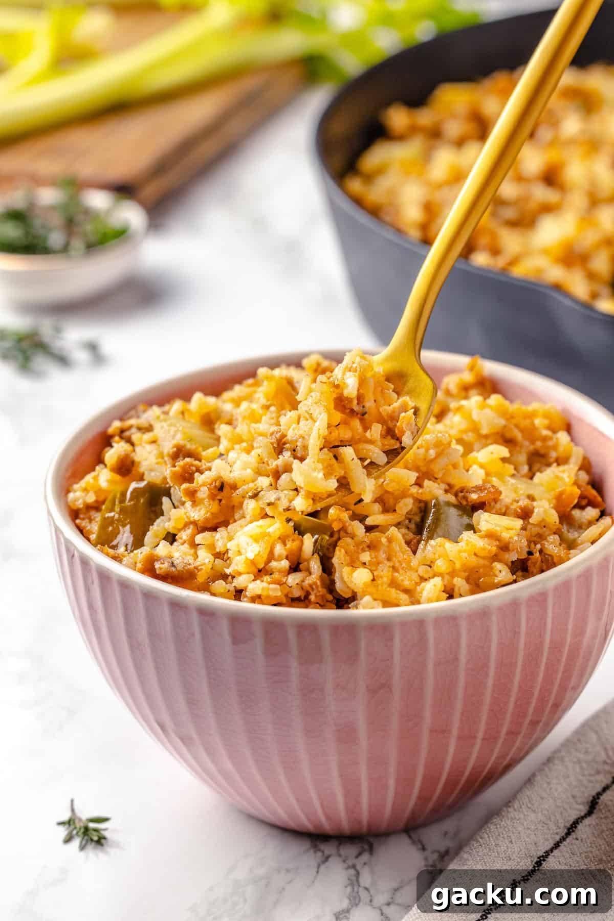 Dirty rice in bowl with fork