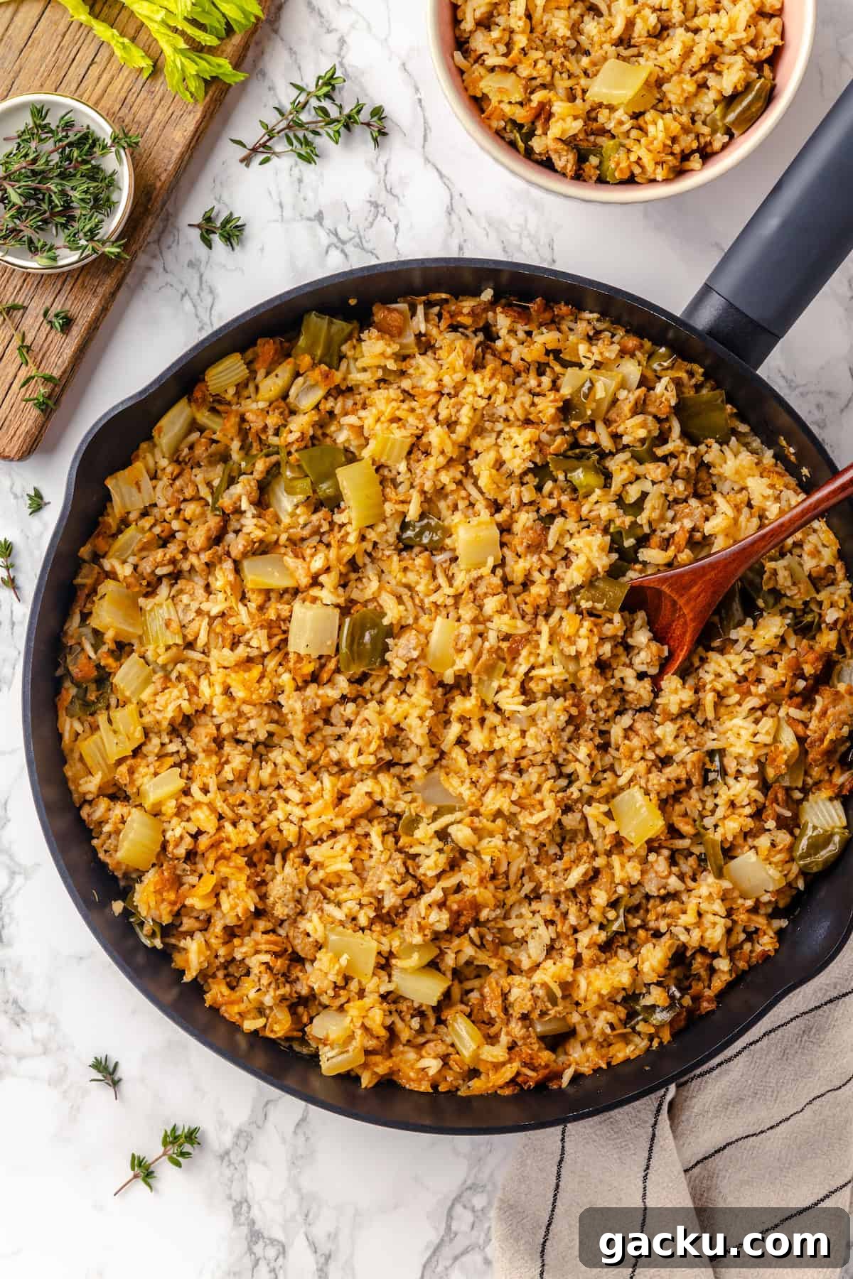 Overhead view of dirty rice in skillet