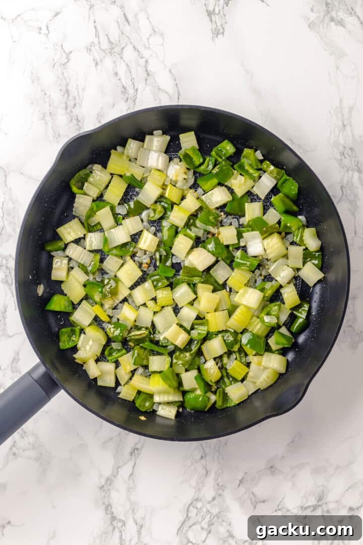 Celery, onion, and green pepper in skillet