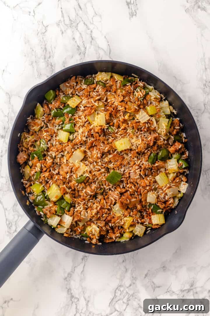 Dirty rice in skillet before adding stock