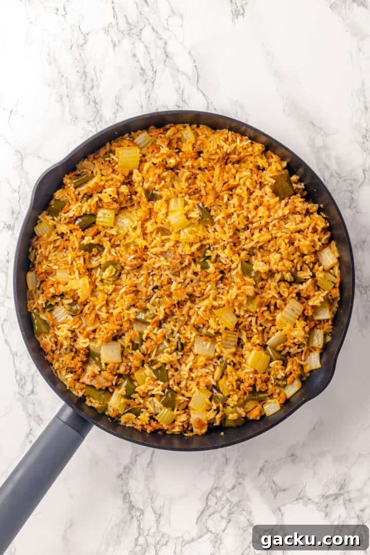 Overhead view of dirty rice in skillet