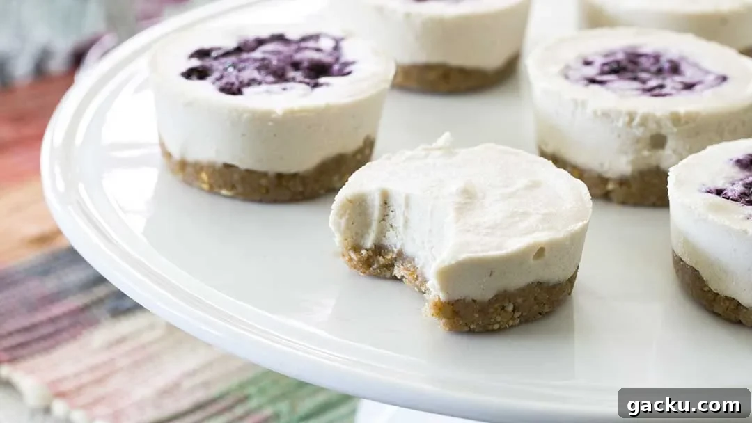 A close-up of a bite taken out of a no-bake vegan cheesecake.