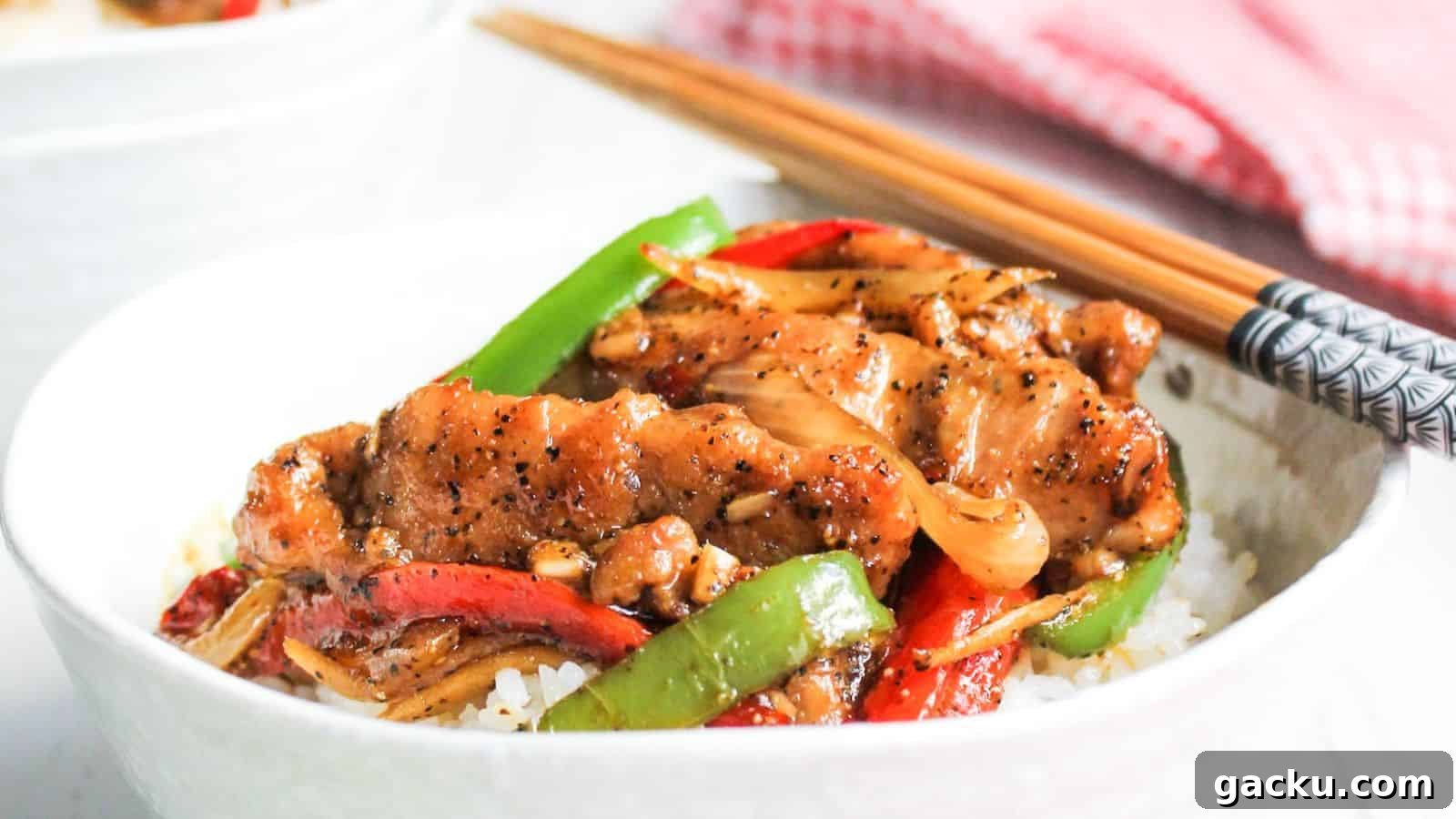 30 One-Pan Skillet Meals for Quick Cleanup and Big Flavor 14 Bowl of black pepper chicken with chop sticks.