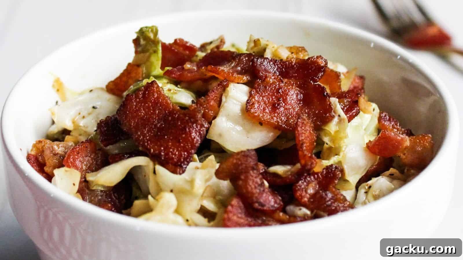 30 One-Pan Skillet Meals for Quick Cleanup and Big Flavor 30 Cabbage and bacon in white serving bowl.