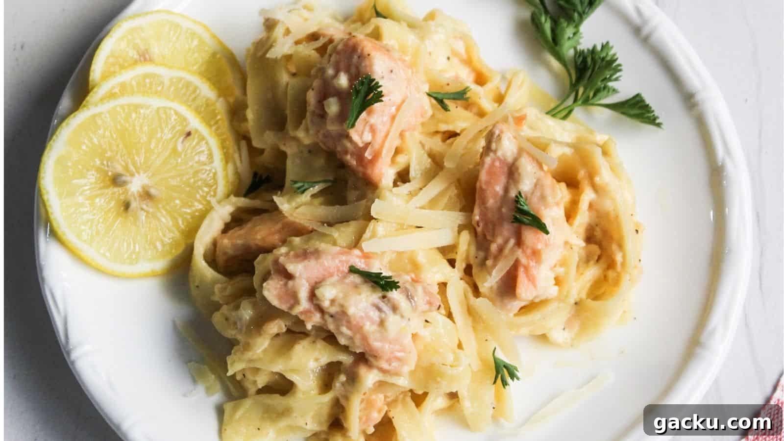 30 One-Pan Skillet Meals for Quick Cleanup and Big Flavor 31 Salmon pasta Alfredo served on a white plate with lemon.
