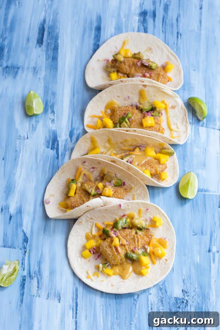 Honey Mustard Fish Tacos with Crispy Slaw and Lime crema 3 Honey Mustard Fish Tacos made with wild caught pollock tenders, onion, mango, avocado, and cheese nestled in a tortilla and drizzled with honey mustard! A tasty dinner on the table in less than 20 minutes.