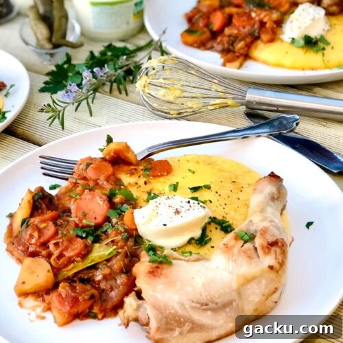 Chicken with garlic, vegetable tomato sauce and polenta