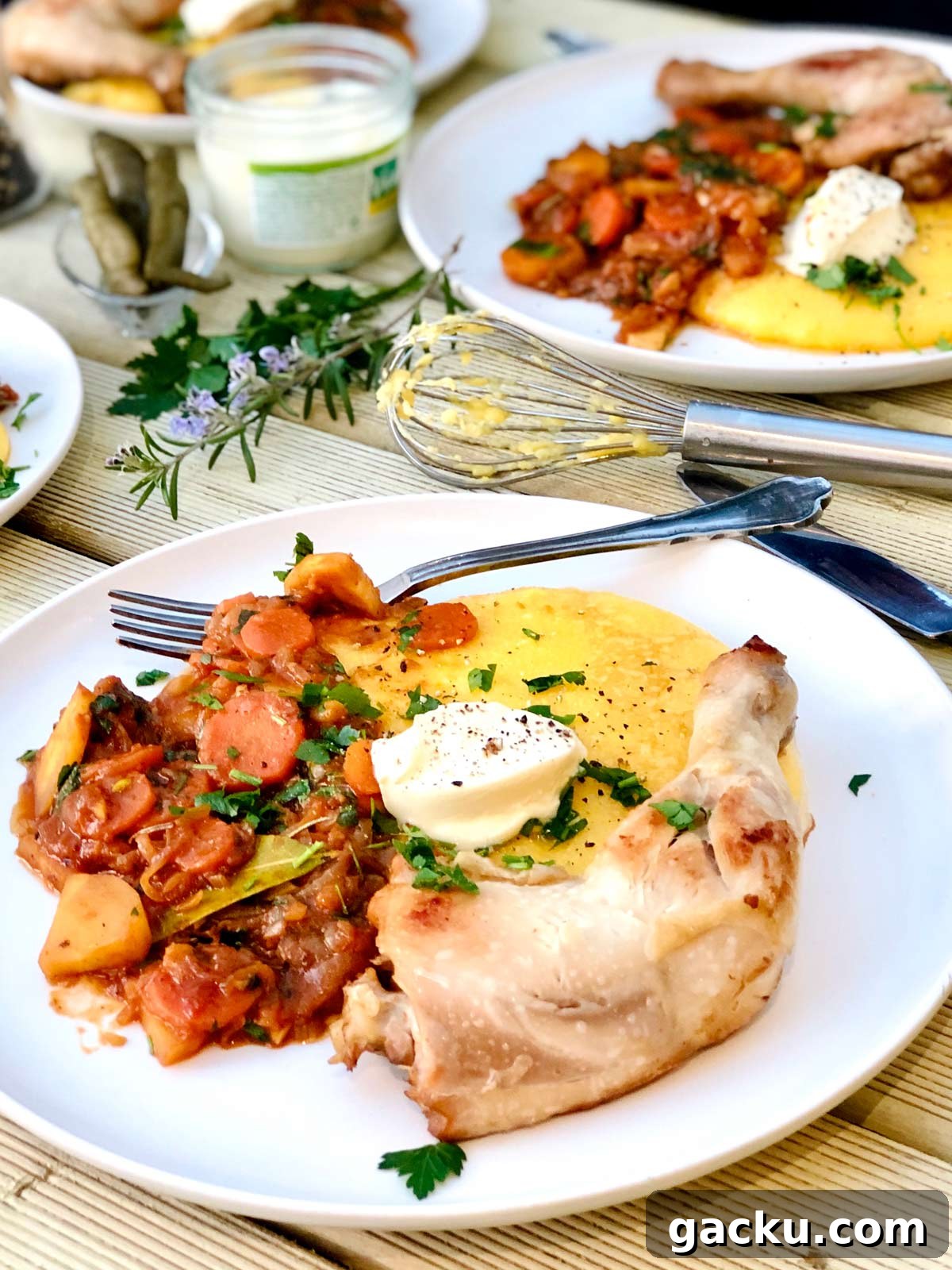 Chicken with garlic, vegetable tomato sauce and polenta