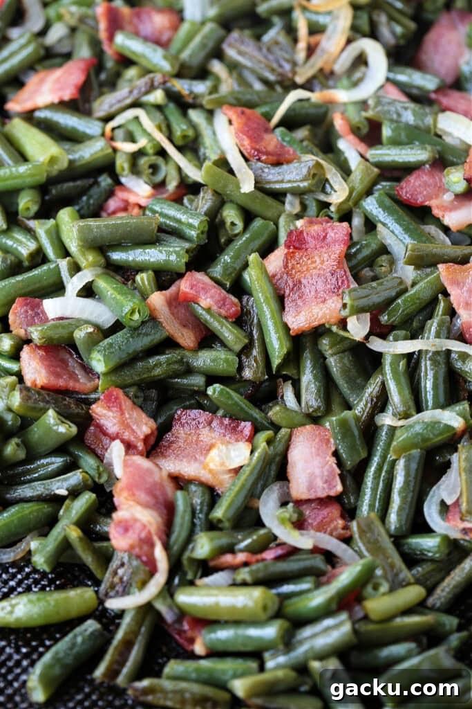 These Green Beans with Bacon are an easy to make, delicious vegetable side dish! Bacon and onions flavor the green beans while they cook! green beans with diced bacon and onions