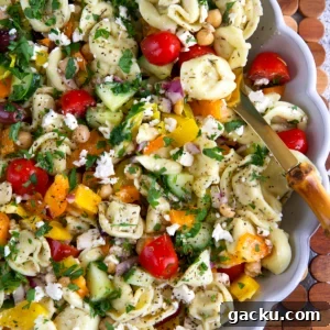Greek Tortellini Salad with Feta, Olives & Lemon Dressing 8 Greek Tortellini Pasta Salad in a fluted white serving bowl